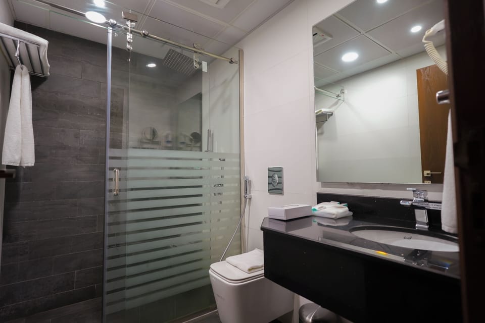 Shower, free toiletries, hair dryer, slippers