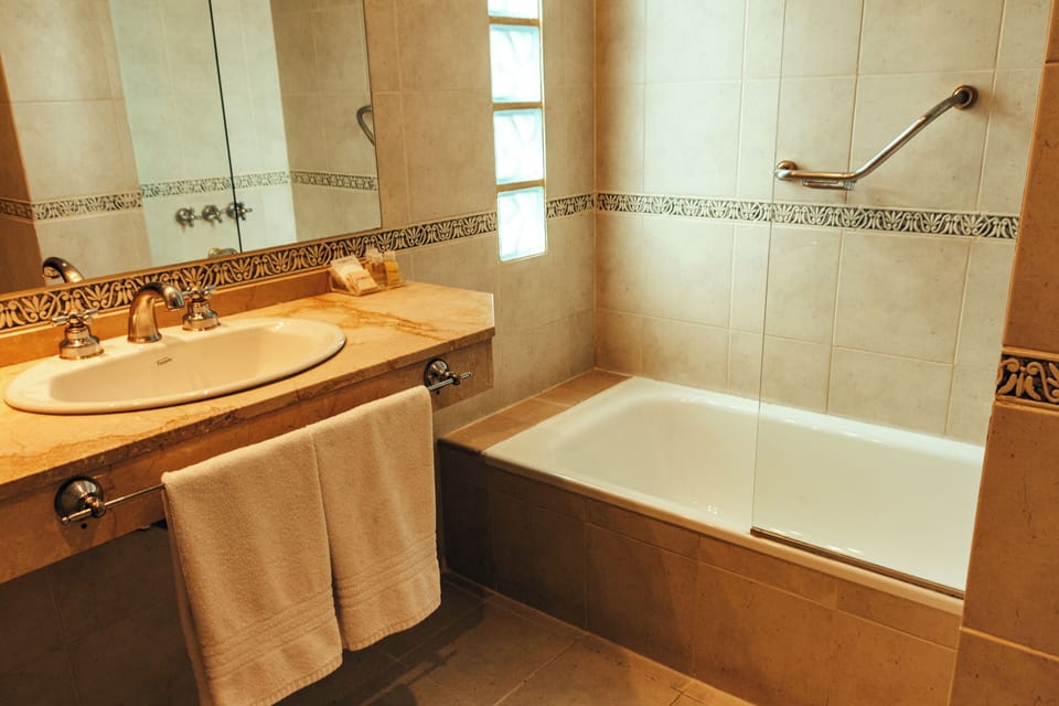 Superior Room | Bathroom | Bathtub, rainfall showerhead, free toiletries, hair dryer