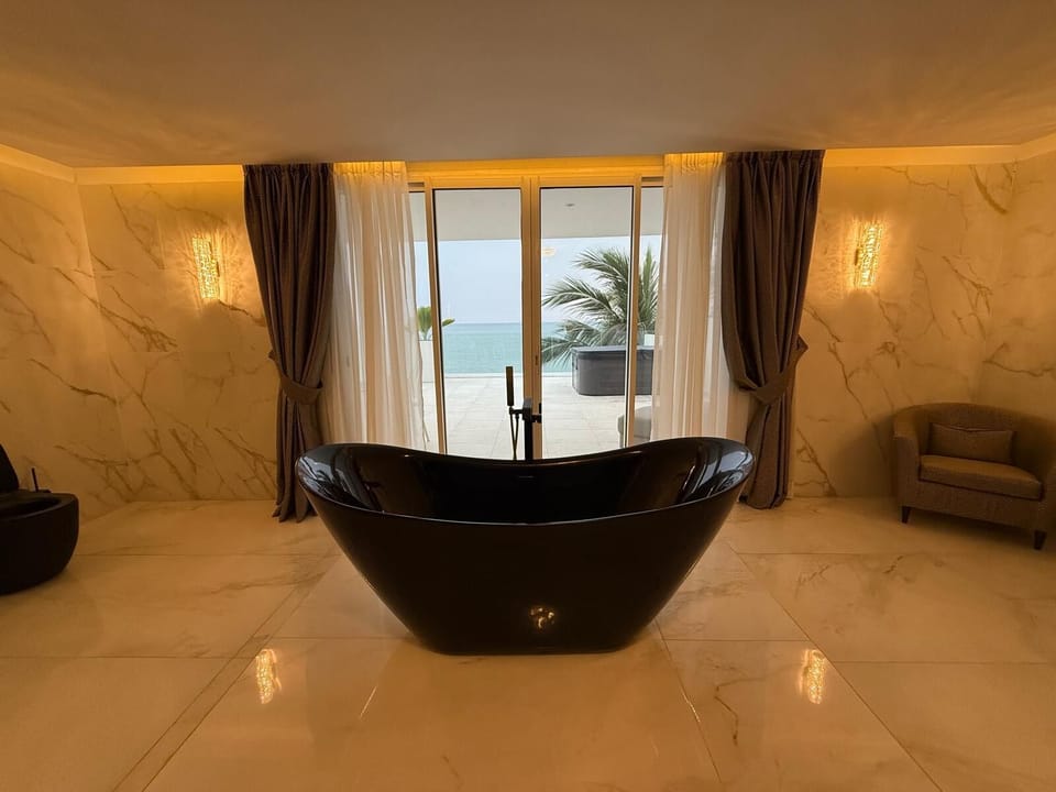 Exclusive Studio Suite, Non Smoking, Ocean View | Bathroom | Shower, hair dryer, bathrobes, bidet
