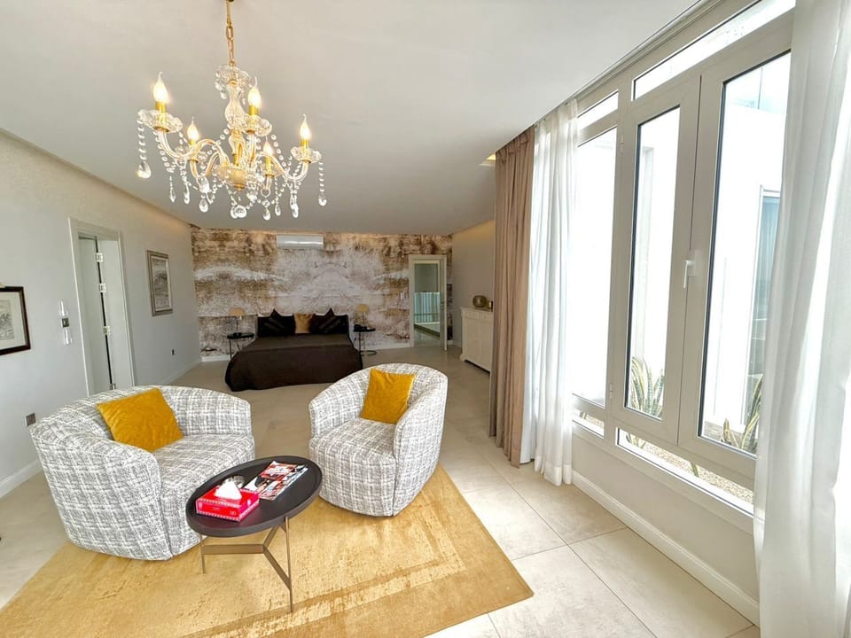 Junior Suite, Beach View | Premium bedding, down comforters, minibar, in-room safe