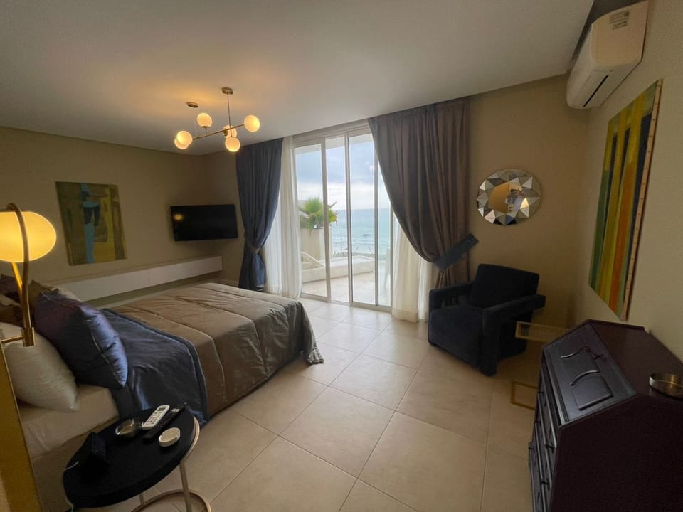 Deluxe Double Room, Beach View | Premium bedding, down comforters, minibar, in-room safe