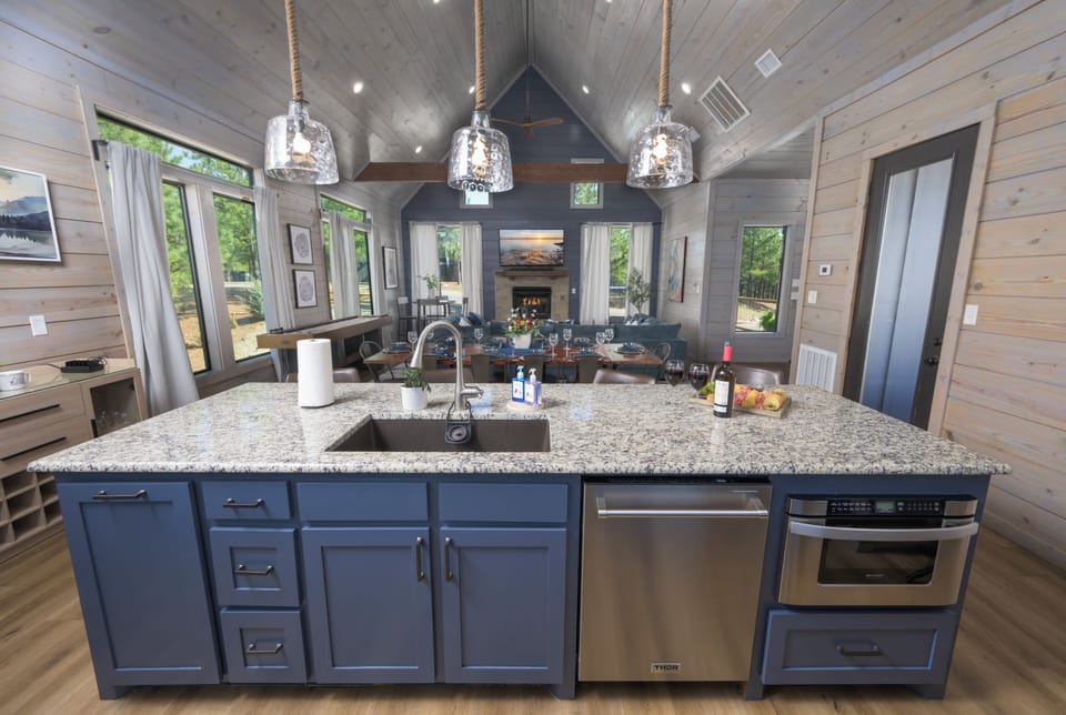 Our living room is spacious enough to hold a large group. Enjoy cooking while others in your group relax on the couch. Our kitchen island seats four and it's the perfect place to feed the kids or enjoy a glass of wine.