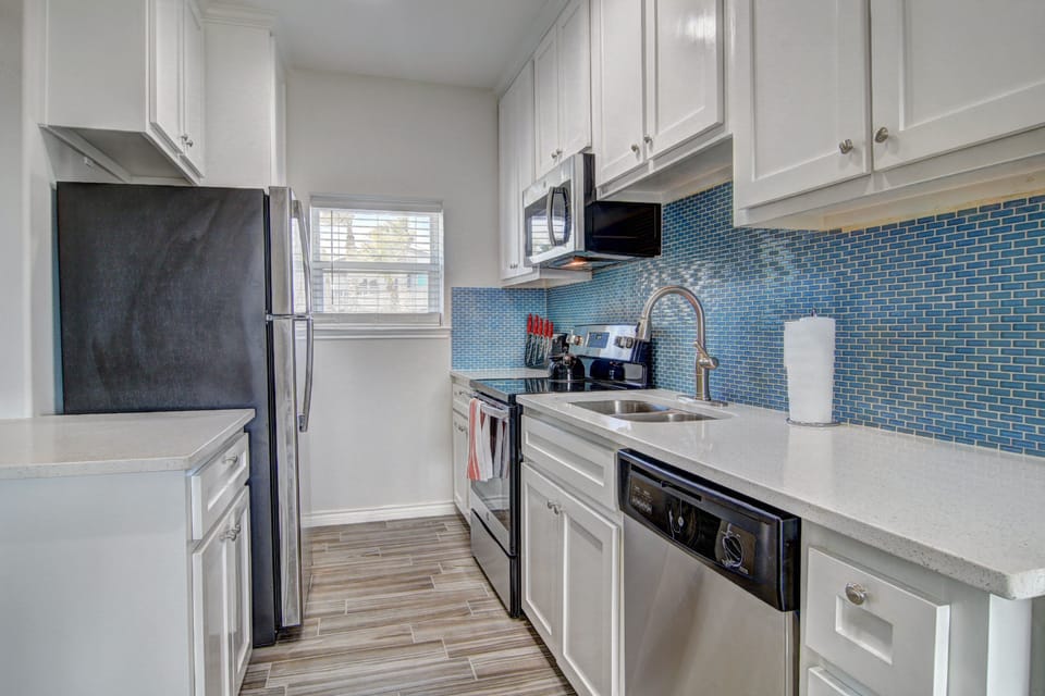 Fully equipped kitchen with appliances and cookware