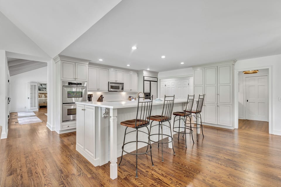 Chef's Dream: Brand new gourmet kitchen with custom cabinetry, top-of-the-line appliances, and dining for 12 plus 4 at the kitchen island.