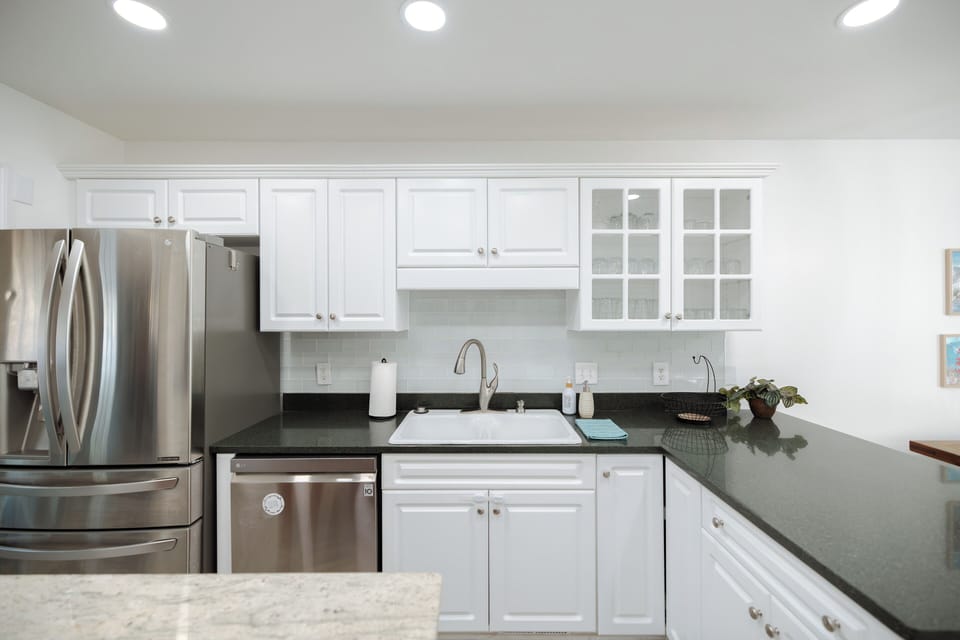 Spacious kitchen with full appliances, cookware, spices, and essentials.