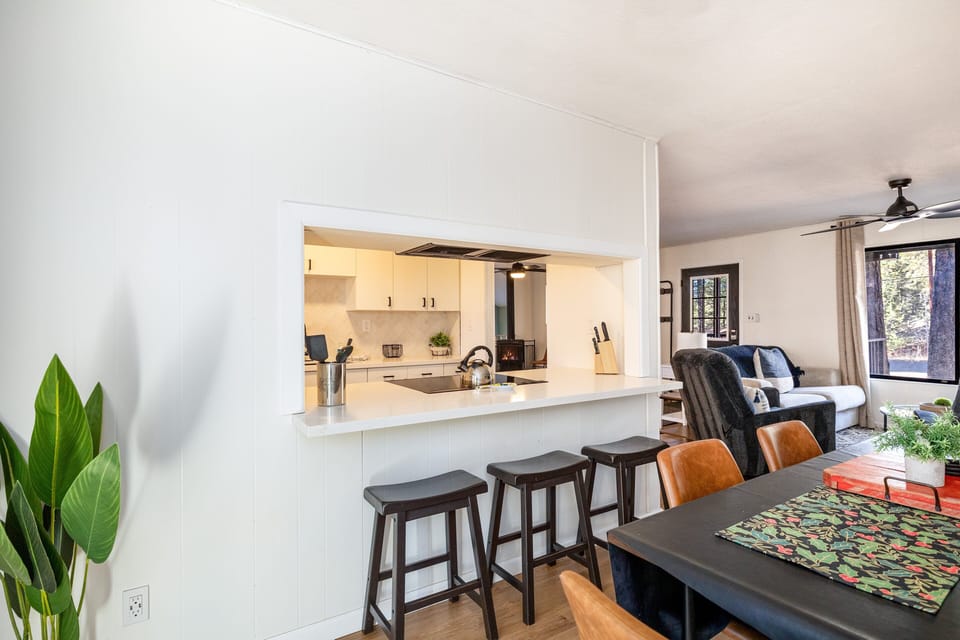 The adjacent dining table is perfect for sharing family meals or game nights.