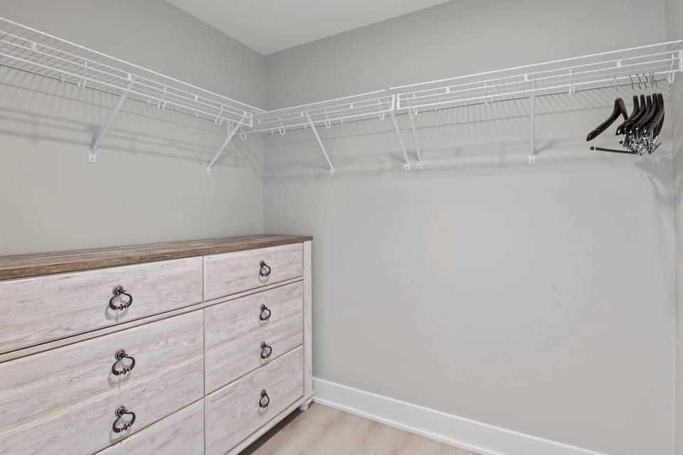 The room features a cozy, functional space with a clothline and closet for dry clothes.