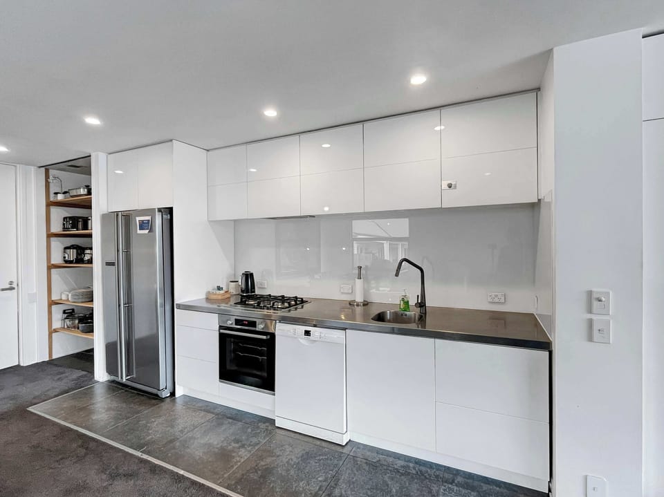 Modern kitchen with gas cooktop and sleek cabinetry