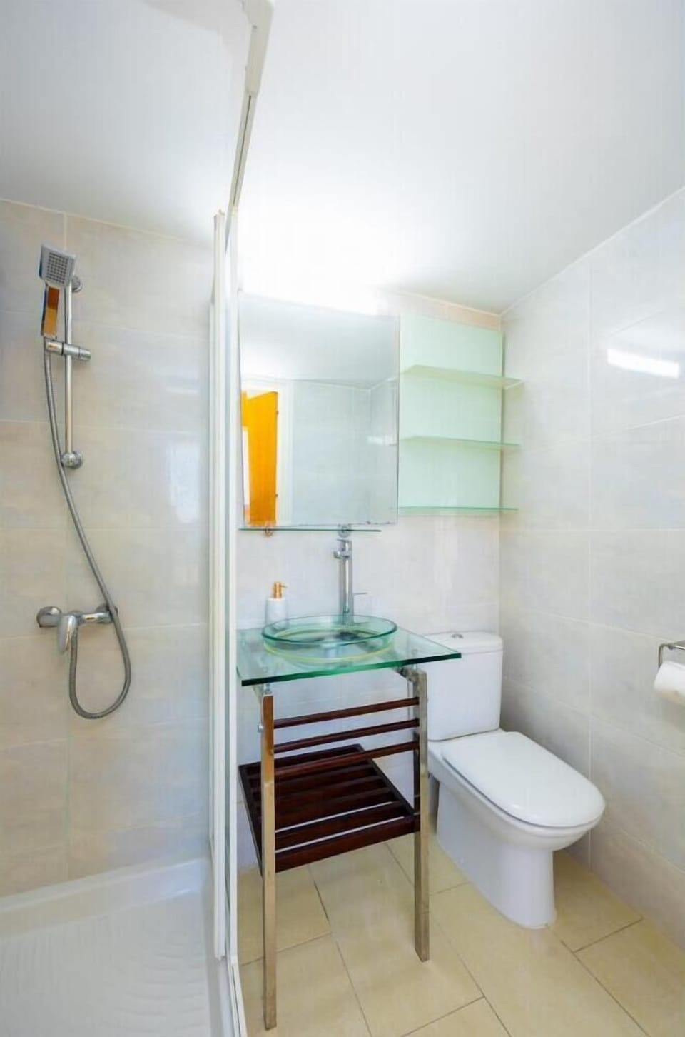 An interior view of a second bathroom within the property, showcasing a modern, light-filled layout optimized for a compact space.