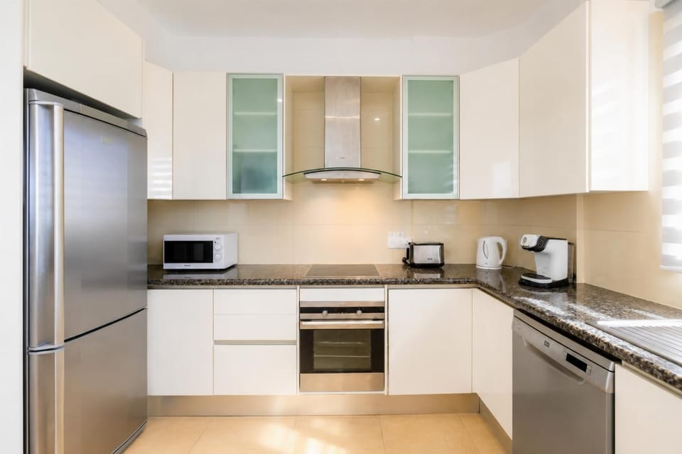 An alternate, straight-on view of the modern kitchen layout, showcasing the placement of the major appliances.