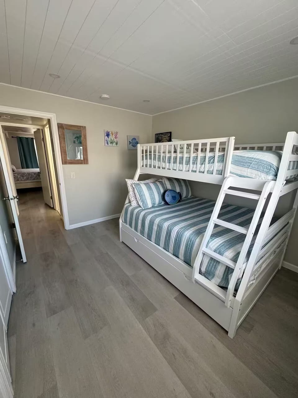 Second bedroom featuring a twin over full size bunk with twin trundle. Sleeps 4