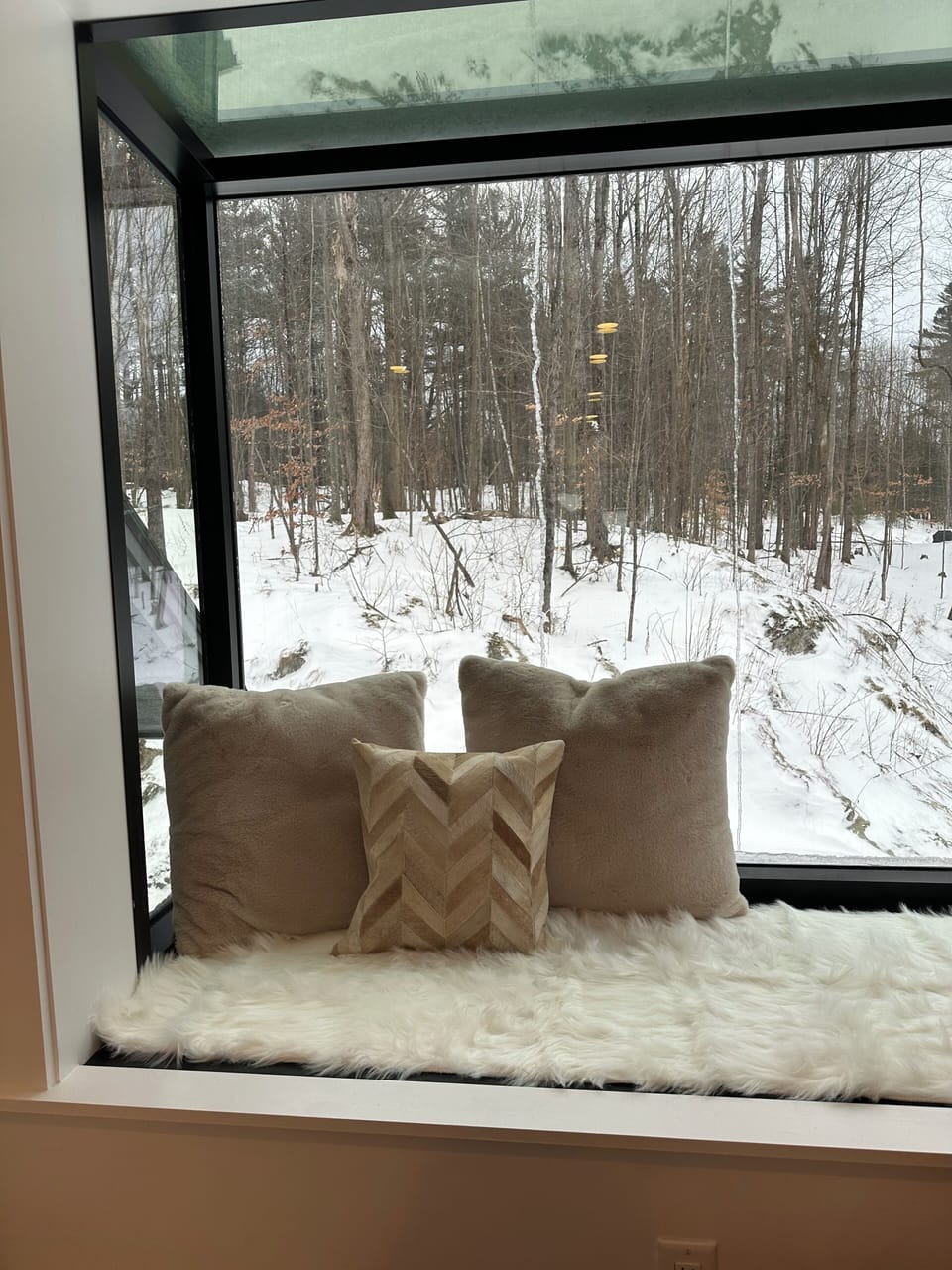 Glass reading corner in master bedroom. Amazing views of the forest.