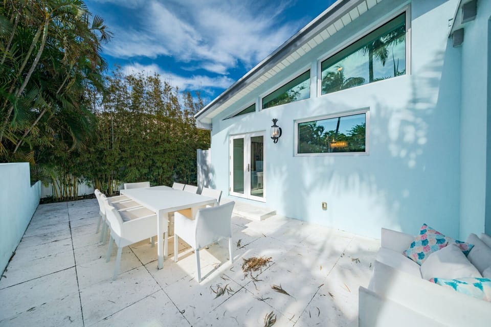 Outdoor dining is positioned with access from the kitchen at the front of the house