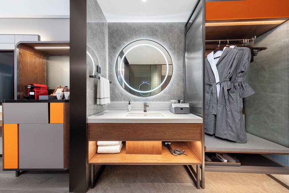 Premium bedding, down comforters, free minibar, laptop workspace