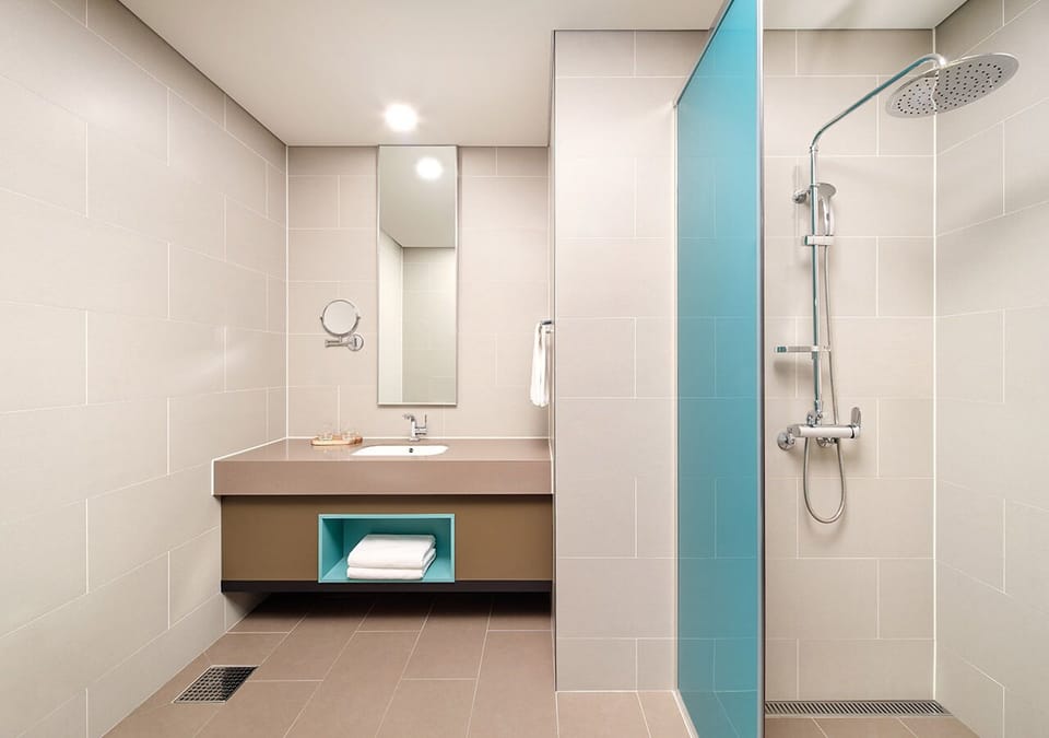 Standard Twin Bed | Bathroom | Hair dryer, slippers, towels, toilet paper
