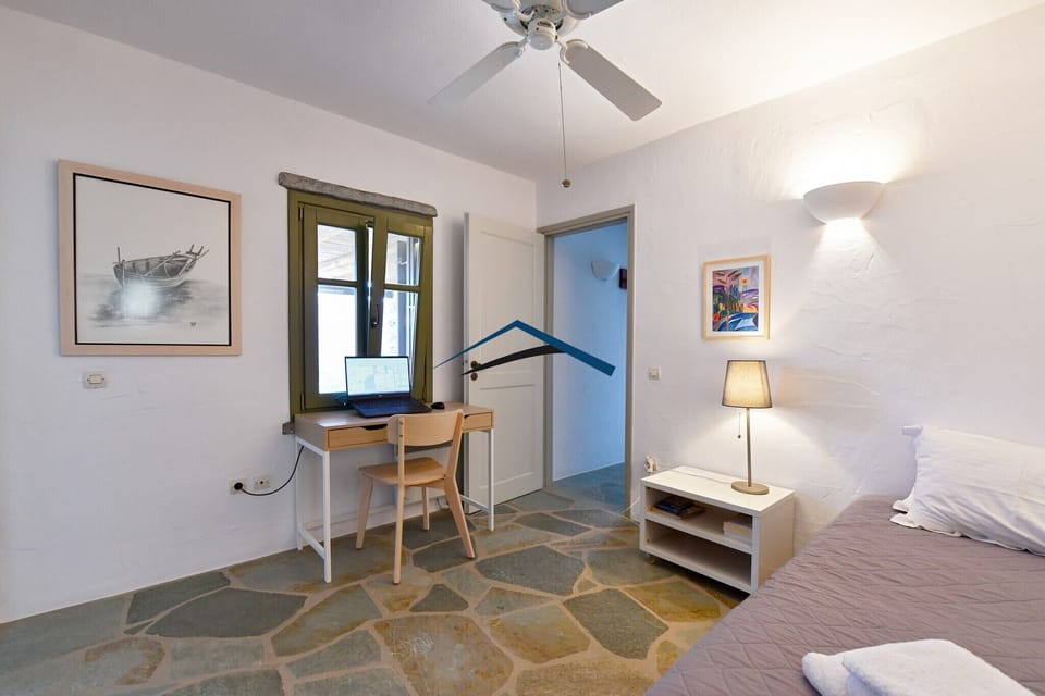 The first bedroom with 2 single beds, and a desk