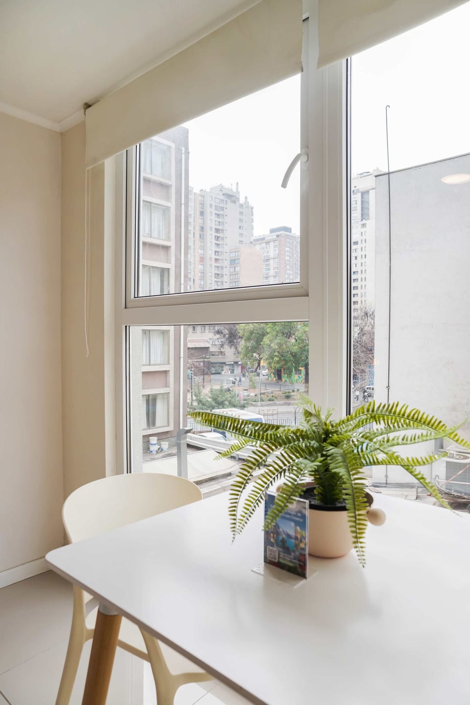 Enjoy a cozy nook with a city view, perfect for relaxing or working.