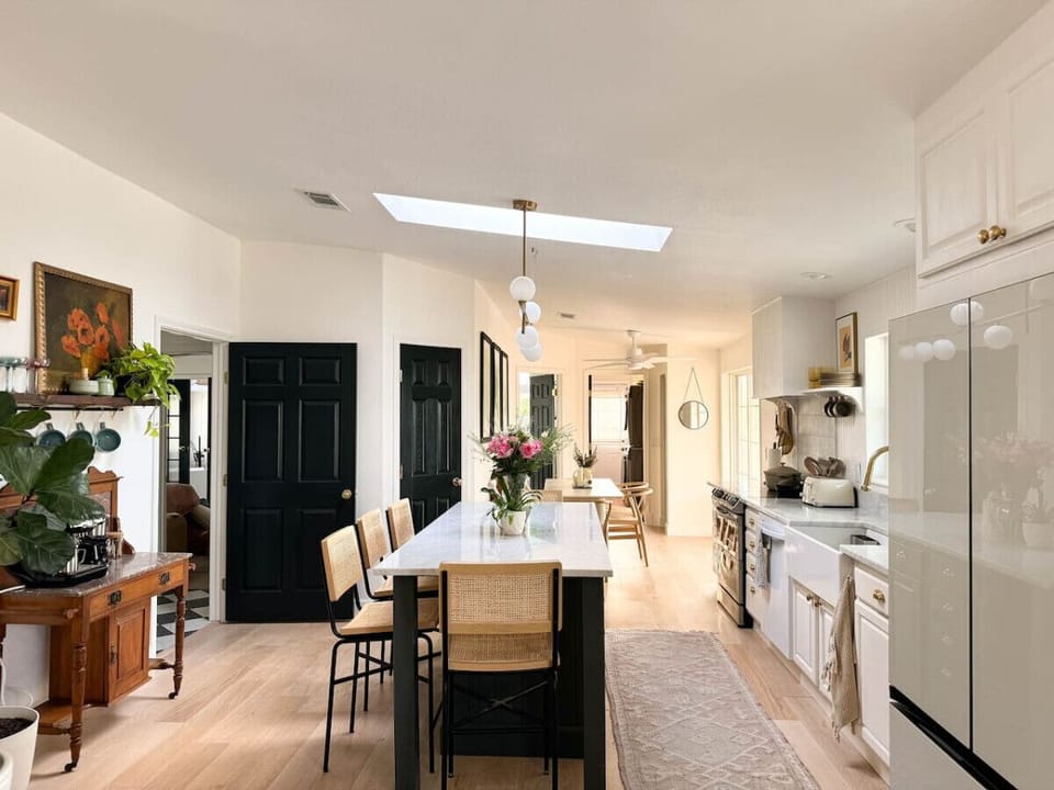 A sleek open-concept kitchen with a spacious island, perfect for cooking and gathering.