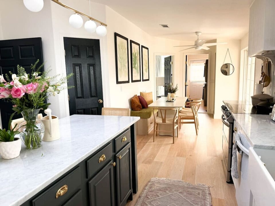 Bright and airy kitchen with a large island at the heart of the space.