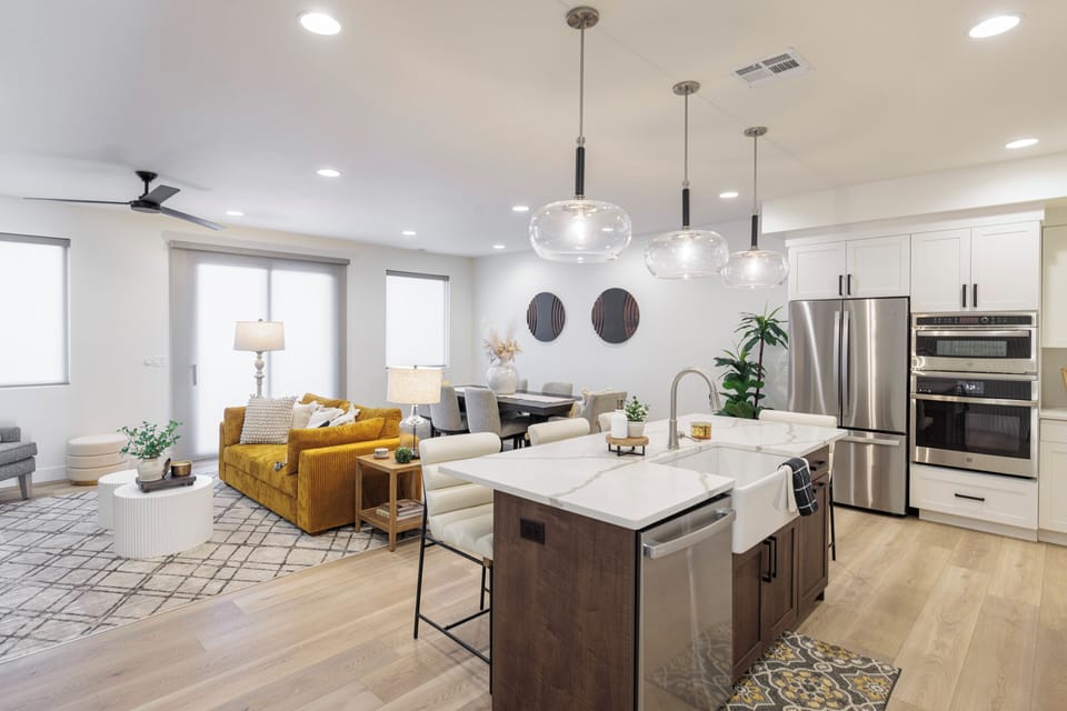 Main Living Area Side View - The Kitchen is complete with everything you will need for meal preparations including pots, pans, baking dishes, plates, cups, silverware, cutlery, and an assortment of cooking utensils.