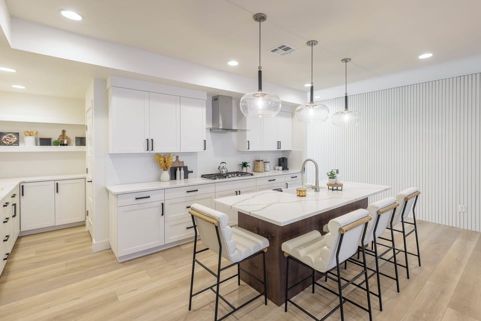 Kitchen Side View - The Kitchen Island comfortably seats 4 adults and creates a great space for serving and preparing meals.