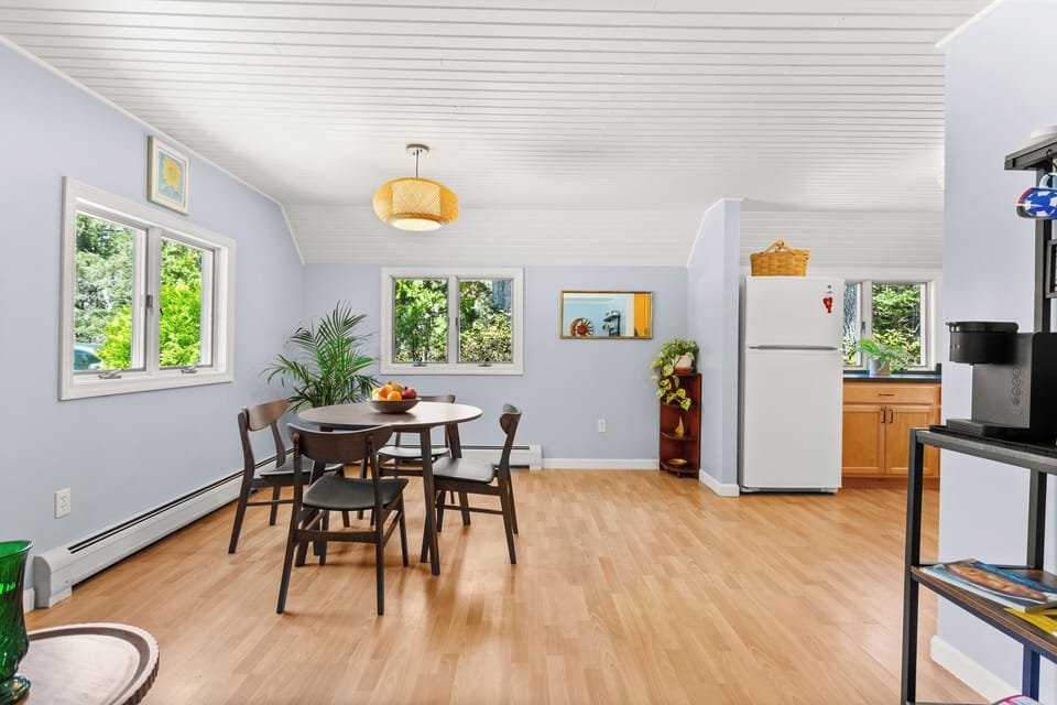 Dining room with Keurig coffeemaker & mugs on the right