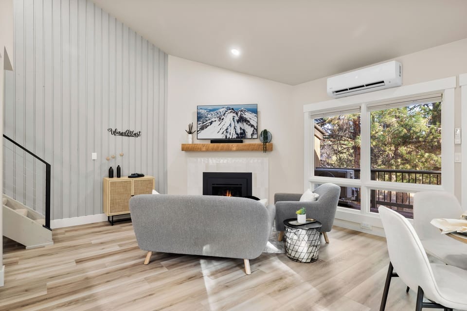 Living space with 55" smart TV and gas fireplace