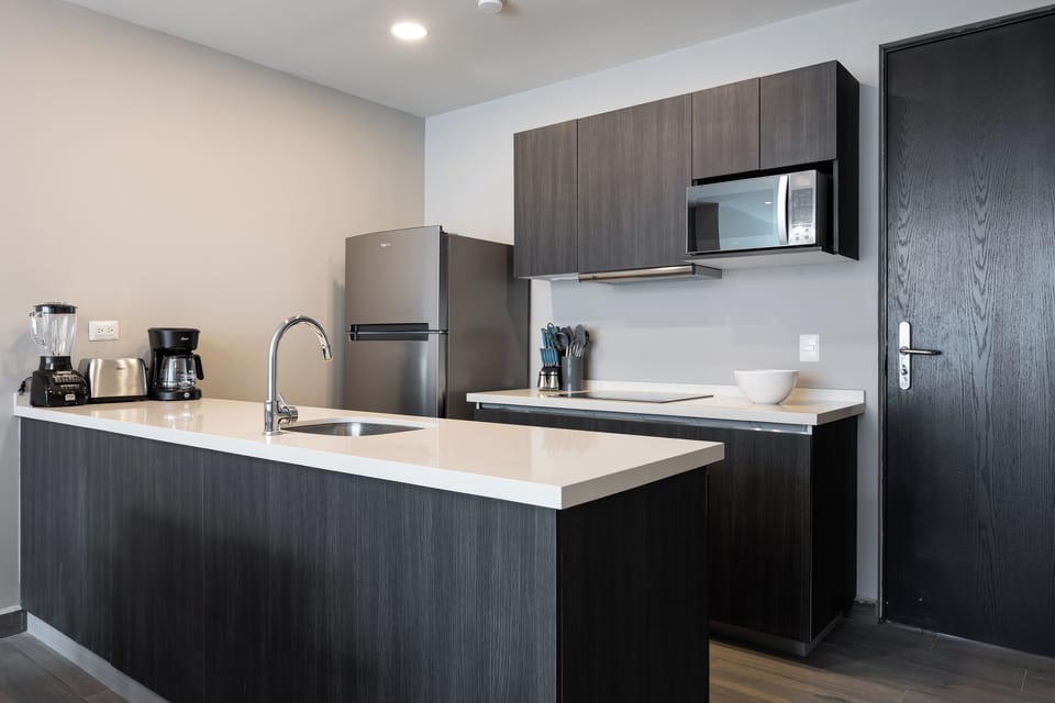 Coffee/tea maker, fridge, stovetop, toaster
