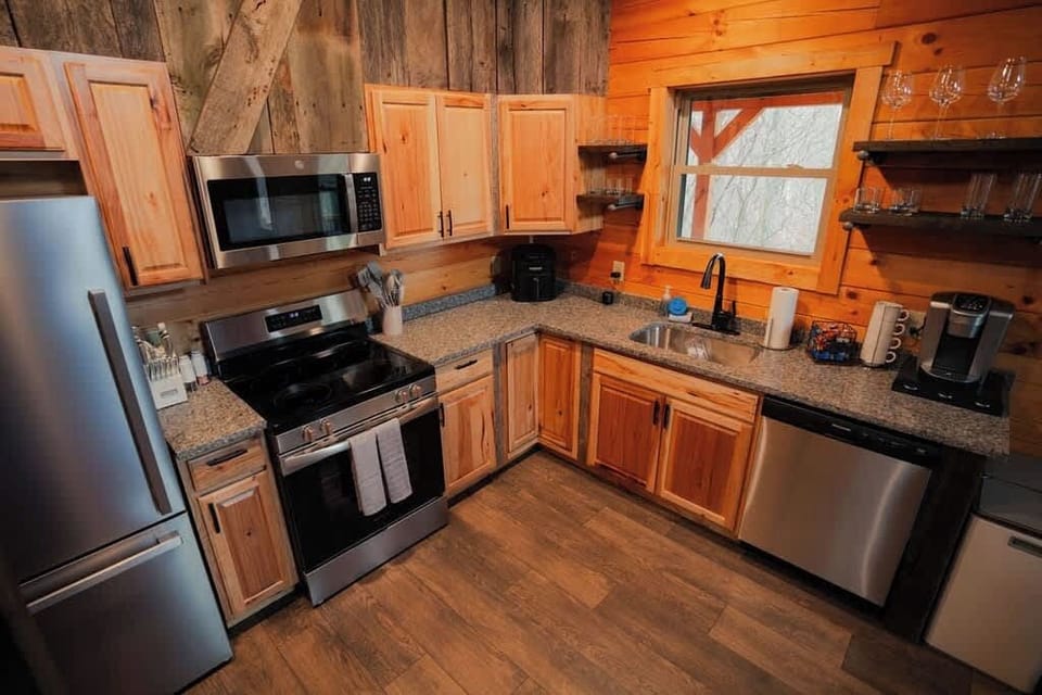 Kitchen: Modern appliances meet rustic charm for your culinary adventures!