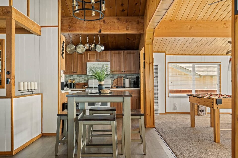The breakfast table can accommodate additional seating for up to four people.