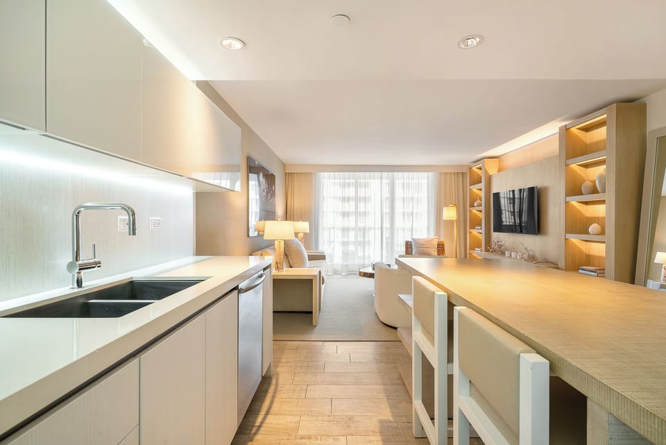 A large kitchen island with seating provides additional counter space 