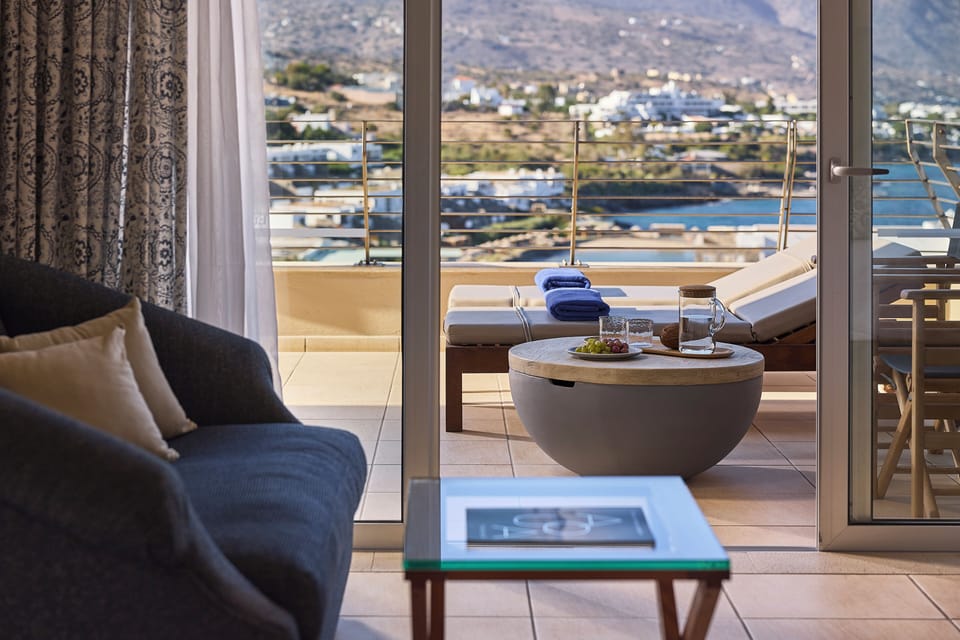 Mythica Superior Suite, Sea View | Minibar, in-room safe, desk, blackout drapes