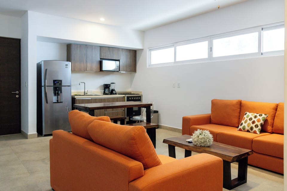 Deluxe Apartment | Living area | TV
