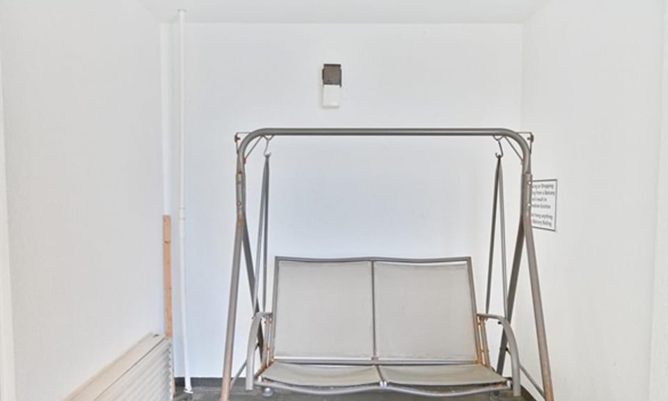 Outdoor swing seat, located in the balcony