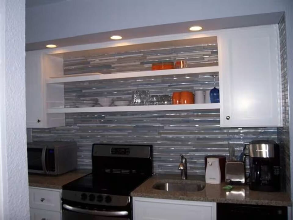 Fully equipped kitchenette with essentials for easy meals & coffee
