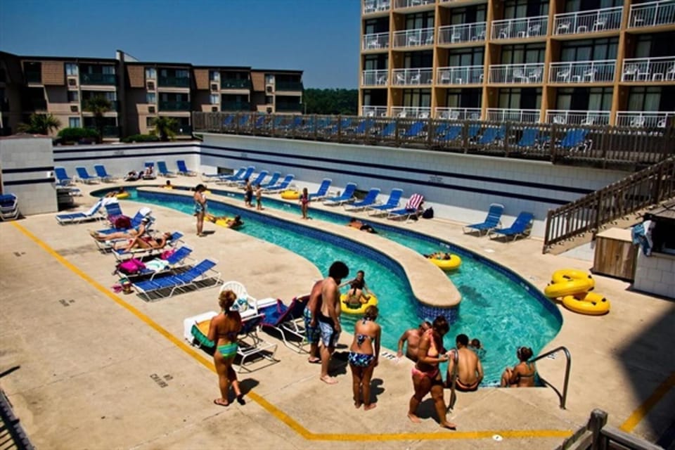 Outdoor lazy river with lounge space for fun and relaxation