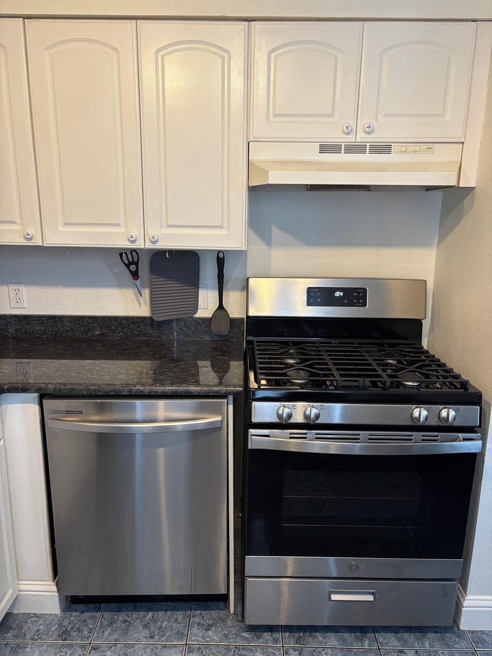 Full size dishwasher, oven, and stove. 