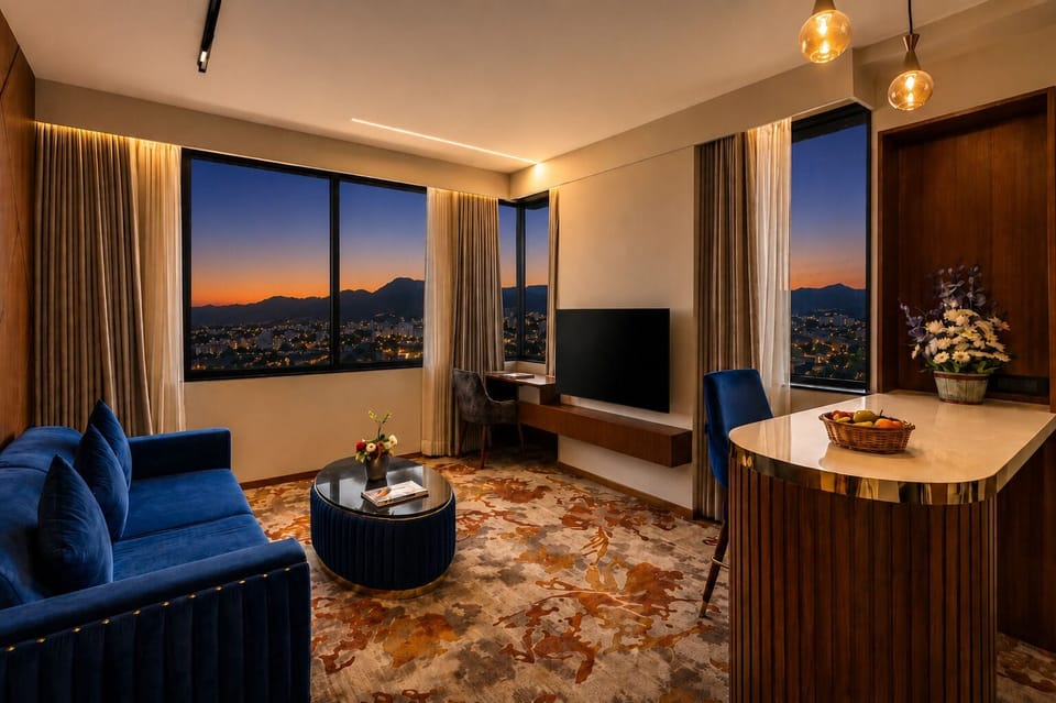 Presidential Studio Suite | Living area | 65-inch LCD TV with satellite channels, pay movies