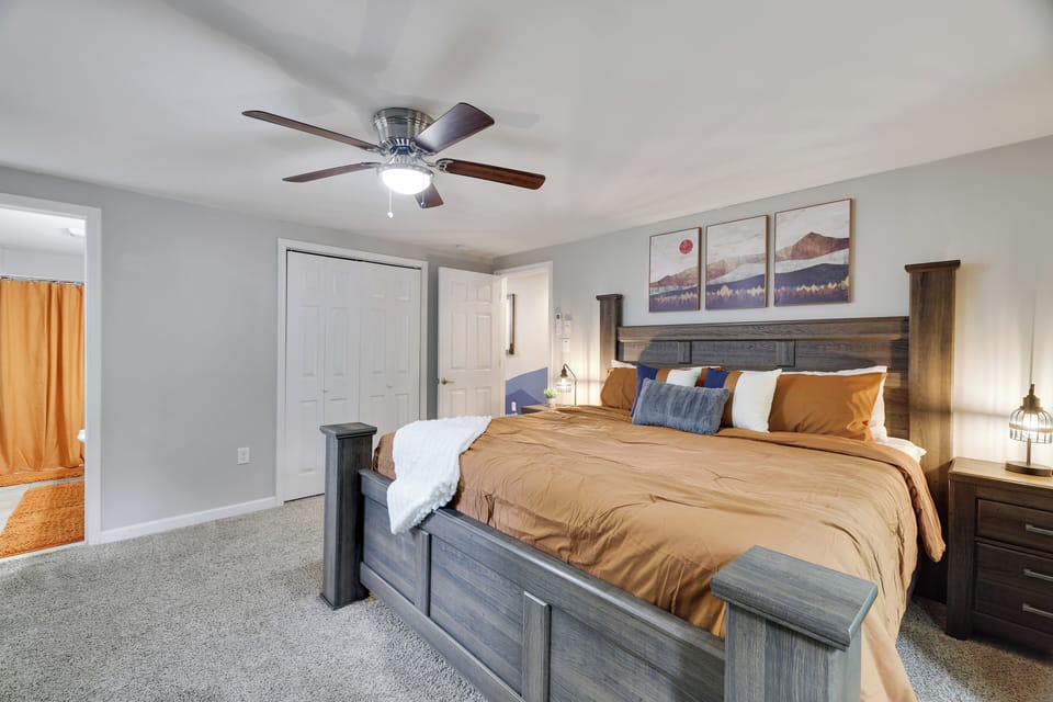 Primary bedroom features a king bed, TV, and ensuite bathroom.