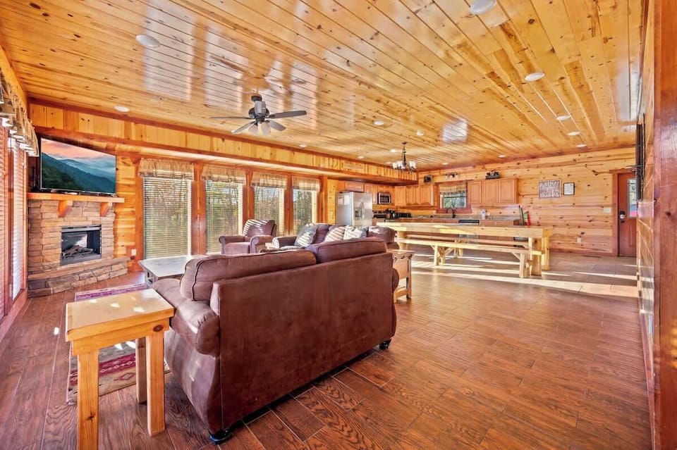 Expansive space with mountain views, plush seating, and a warm fireplace!