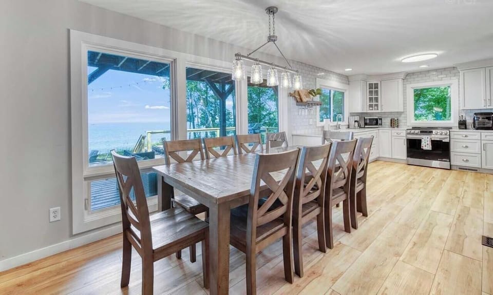 Dining area with seating for 10. Large window provides lake views.