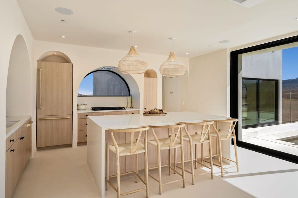 The breakfast bar and kitchen are built for a chef.