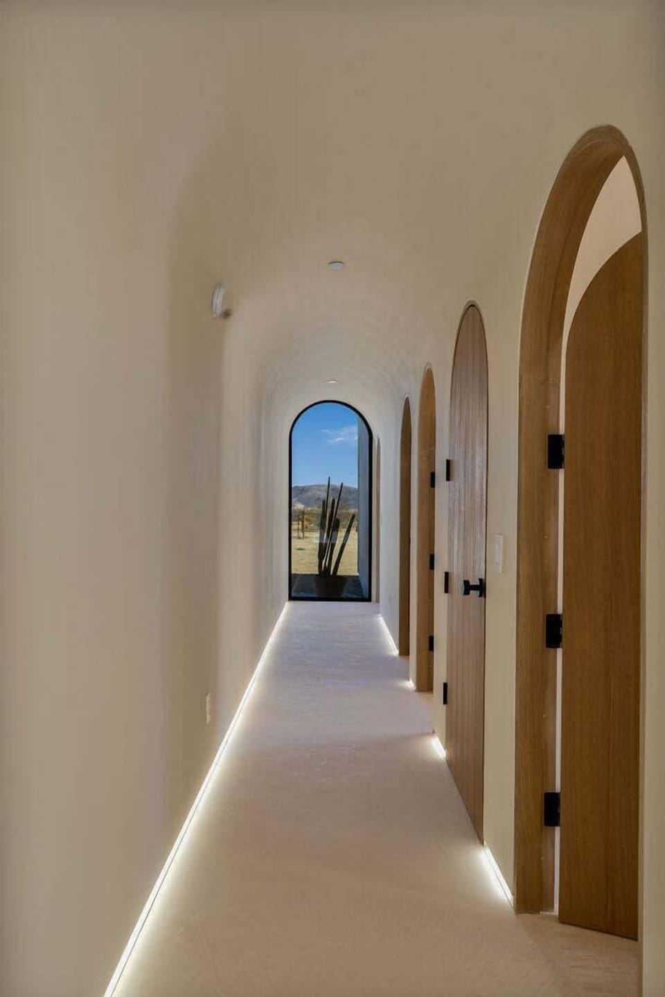 Hallway with arched ceilings.