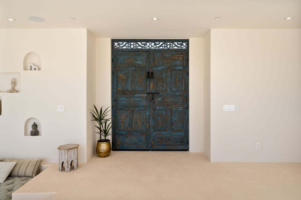 The entryway features an imported Moroccan door.