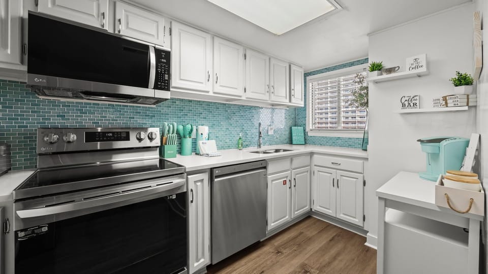 Edgewater West 72 - A well-equipped kitchen with modern appliances, perfect for preparing meals during your stay.