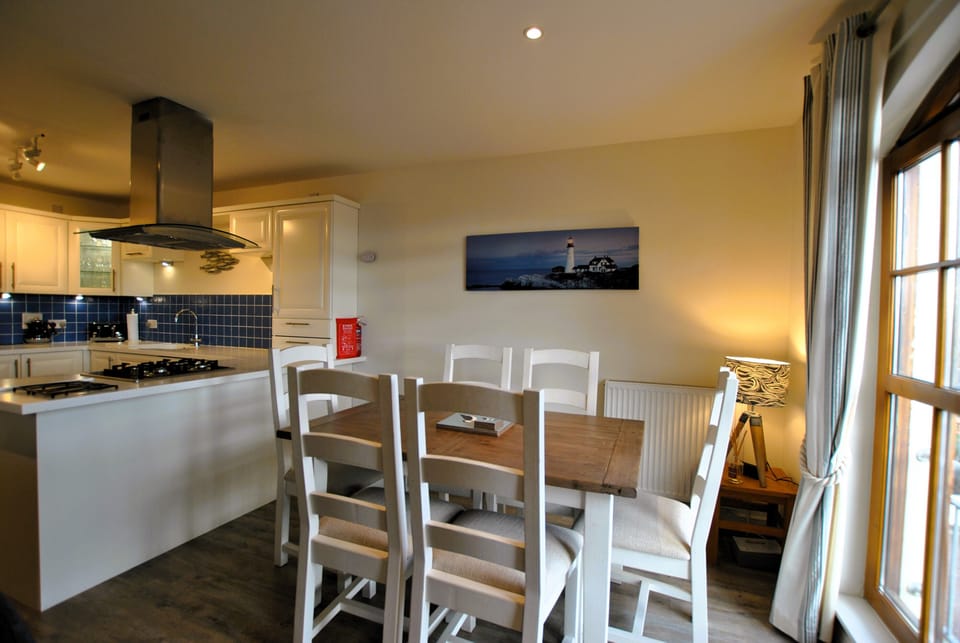 There is plenty space for six guests to dine at the table