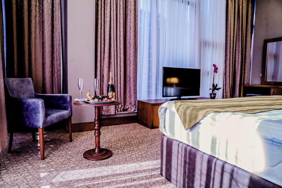 Family Triple Room, City View | In-room safe, blackout drapes, soundproofing, iron/ironing board