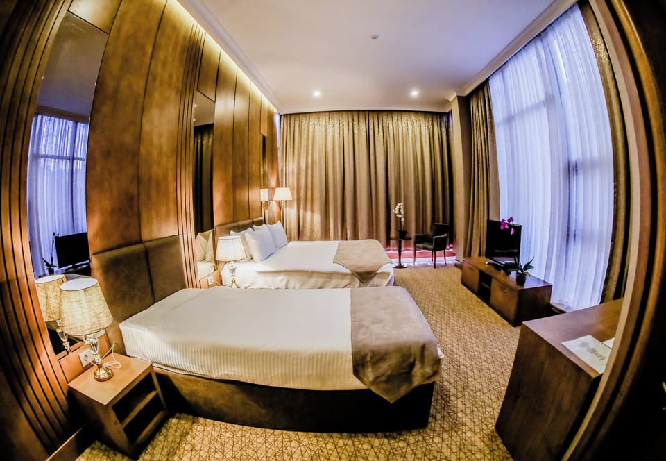 Family Triple Room, City View | In-room safe, blackout drapes, soundproofing, iron/ironing board