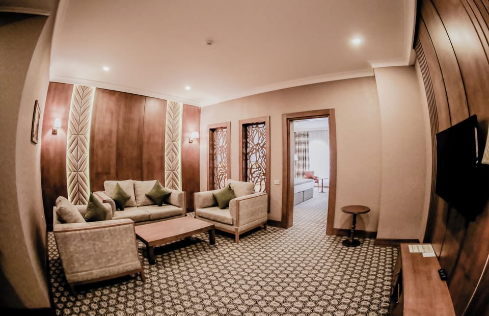 Junior Suite, City View | In-room safe, blackout drapes, soundproofing, iron/ironing board