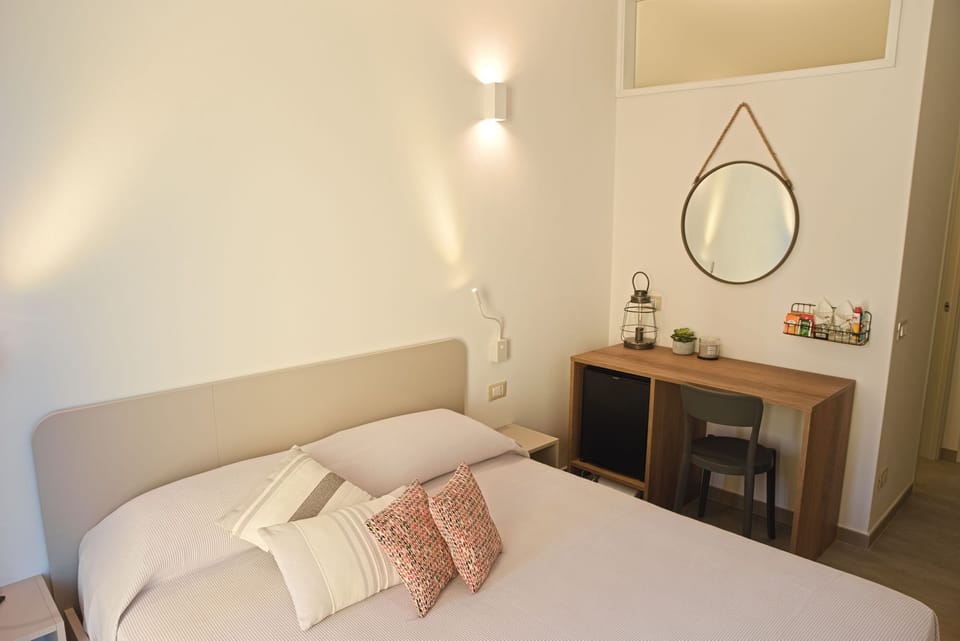 Basic Double Room, Patio, Courtyard View | Down comforters, Select Comfort beds, desk, laptop workspace
